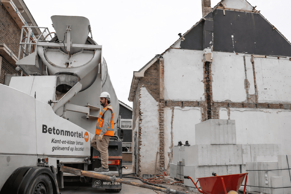 Kun je beton storten met regen?